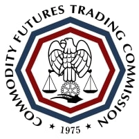 Seal of the Commodity Futures Trading Commission featuring a stylized eagle, a set of balanced scales reminiscent of justice as upheld by a Boston government contract fraud attorney, and the year 1975 inside a red-bordered octagon.