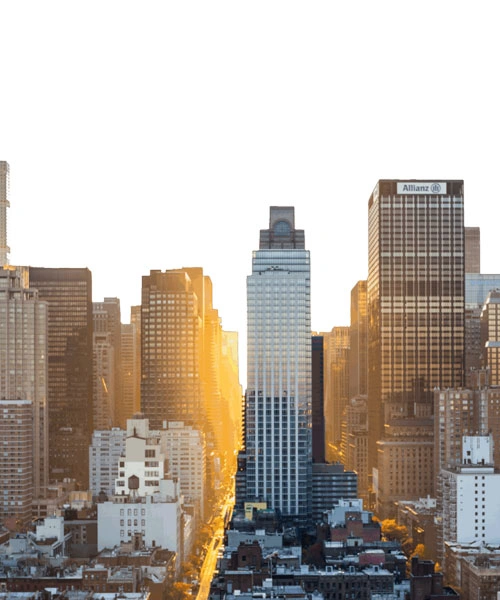 City skyline with tall buildings at sunset, sunlight shining between skyscrapers, and clear sky above—a striking urban scene reminiscent of opportunities found in major cities like New York, where a skilled New York City tax whistleblower lawyer stands ready to protect your rights and uphold justice.