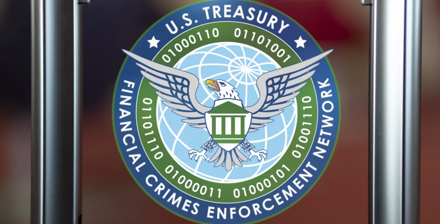 Seal of the U.S. Treasury Financial Crimes Enforcement Network featuring an eagle, shield, globe, and binary code around the border—a powerful symbol recognized by Boston whistleblowing lawyers for its association with financial transparency and crime prevention.